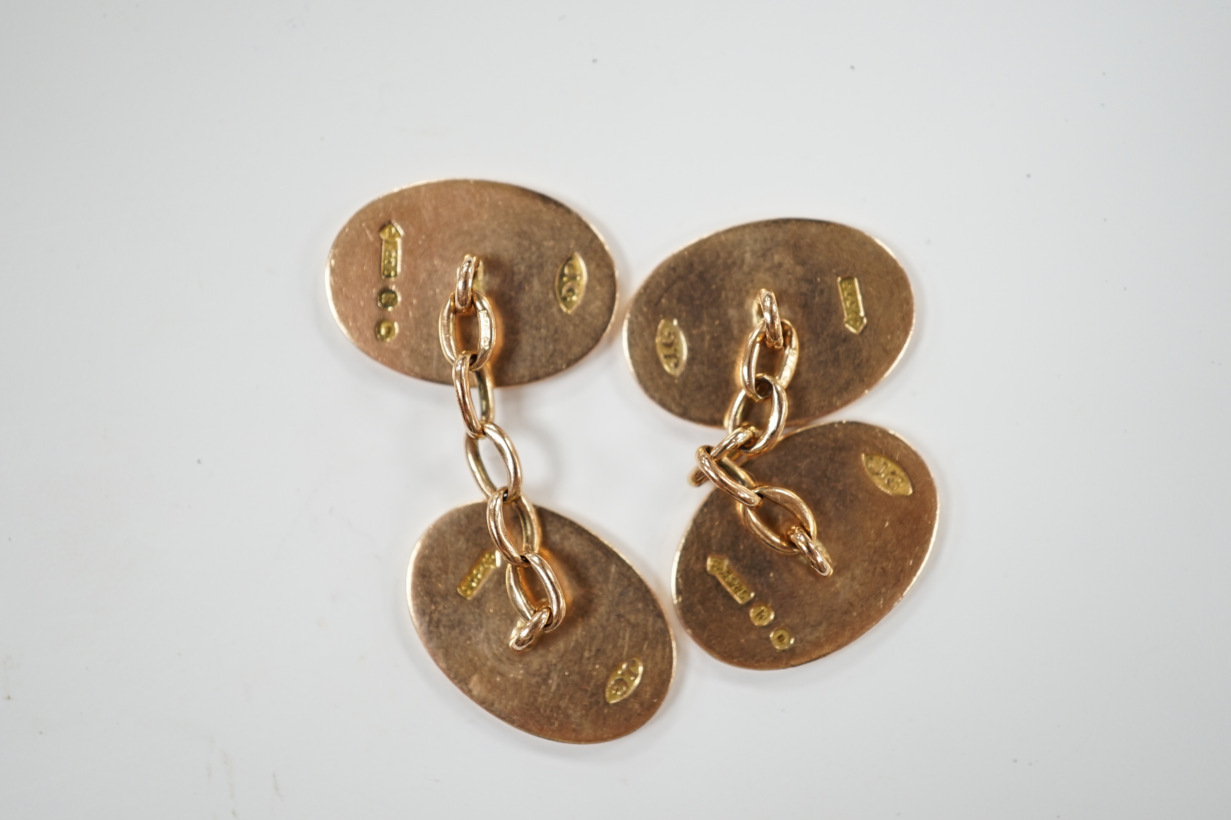 A pair of George V 9ct gold oval cufflinks, with engraved monogram